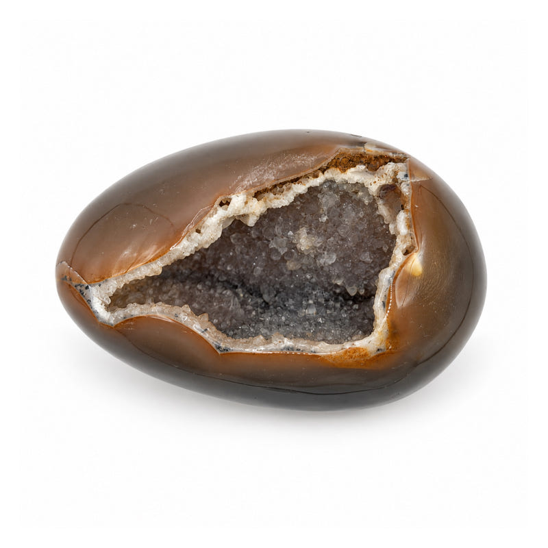 Brown and gray stone egg resting on its side, with a broad opening lined with natural crystals.