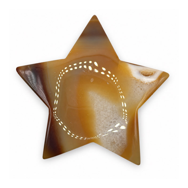 Opposite face of an amber-brown stone star with a pale cloudy band and a small cream-edged patch near one point.